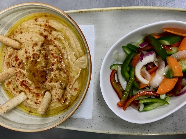 Hummus with vegetable garnish